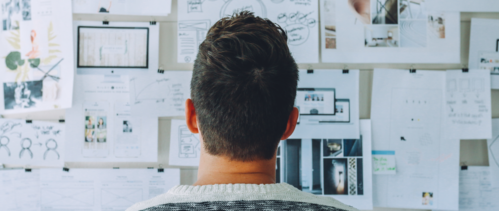 Man looking at plan